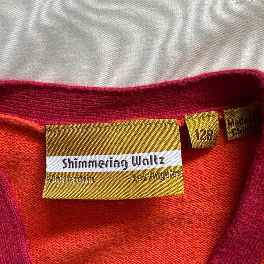 Shimmering Waltz Kid’s Orange Cardigan with Magenta Trim - Picture 4 of 4